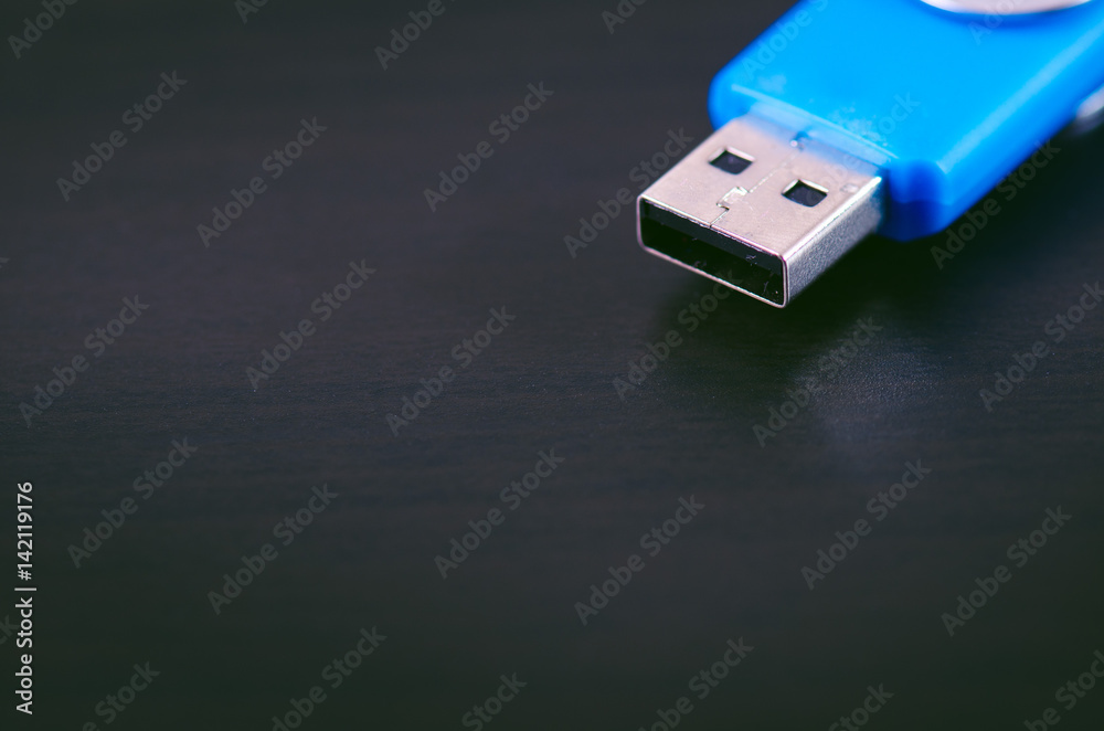 Usb flash drive on a black background. Flash drive is located in the corner of picture. Concept of technology Usb flash drive on a black background. Flash drive is located in the corner of picture. Concept of technology