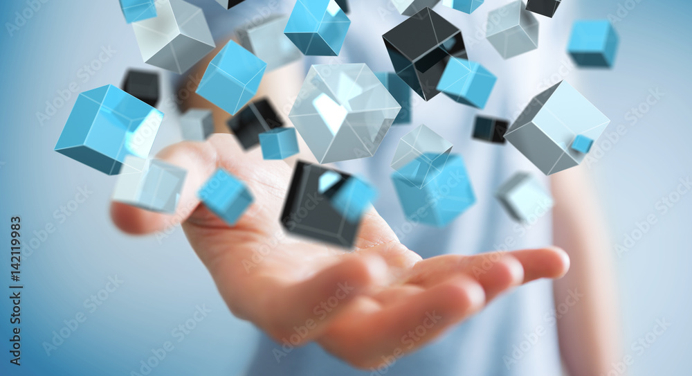 Businessman holding floating blue shiny cube network 3D rendering Businessman holding floating blue shiny cube network 3D rendering