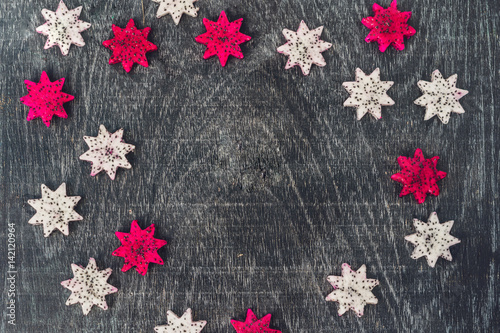 Pieces of sliced dragon fruit in the form of a star on an old withered background photo