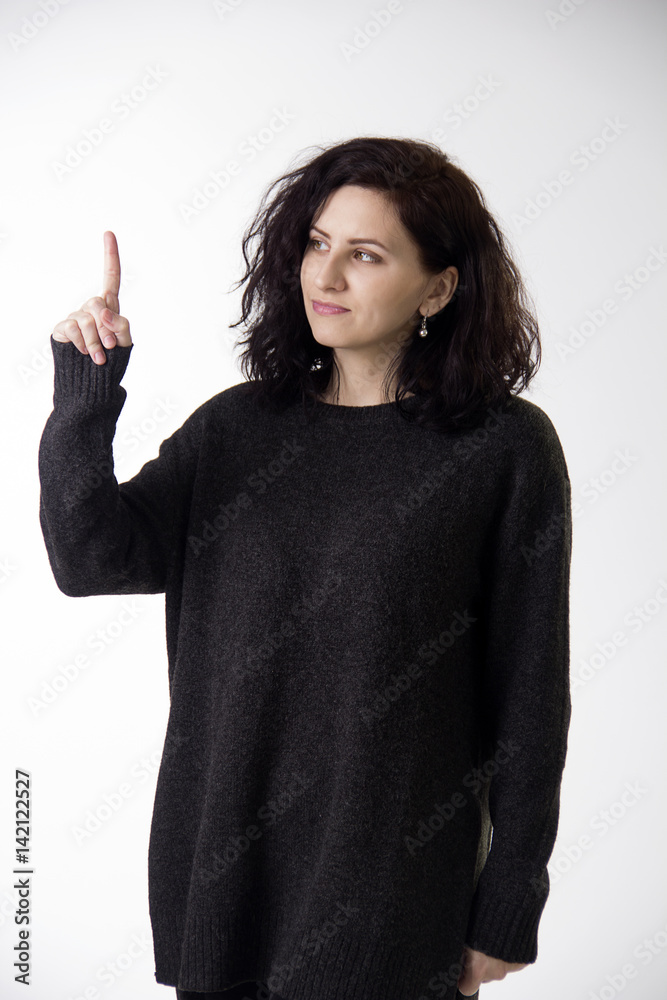 Woman with dark hair showing one (1) on fingers