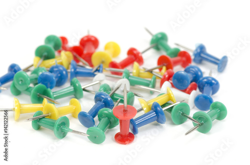 Set of push pins in different colors, with real shadows, isolated on white background