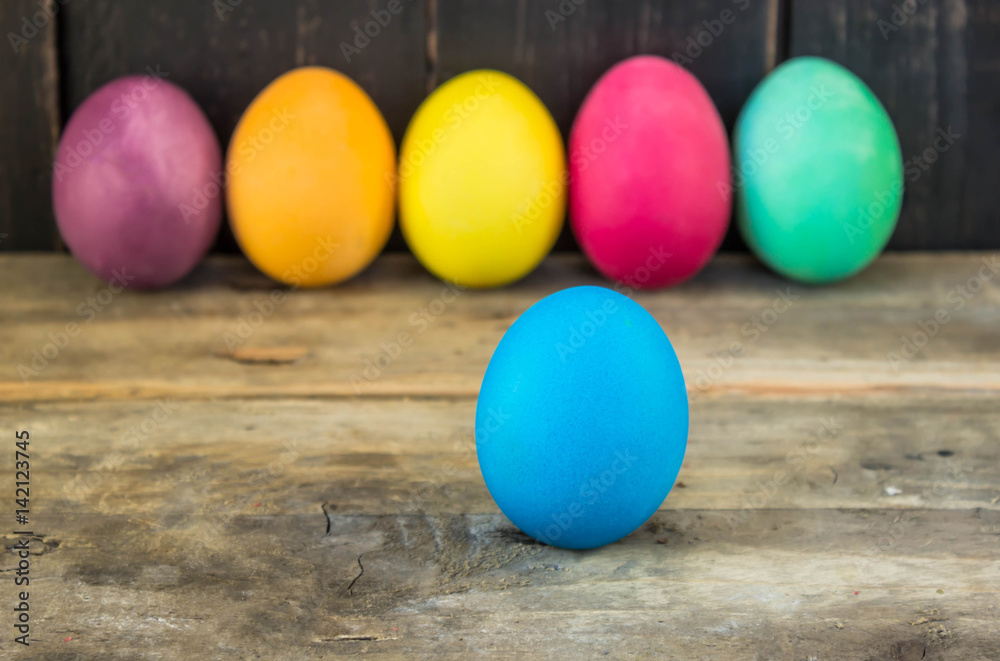 Colorful handmade easter eggs on a wooden table Colorful handmade easter eggs on a wooden table