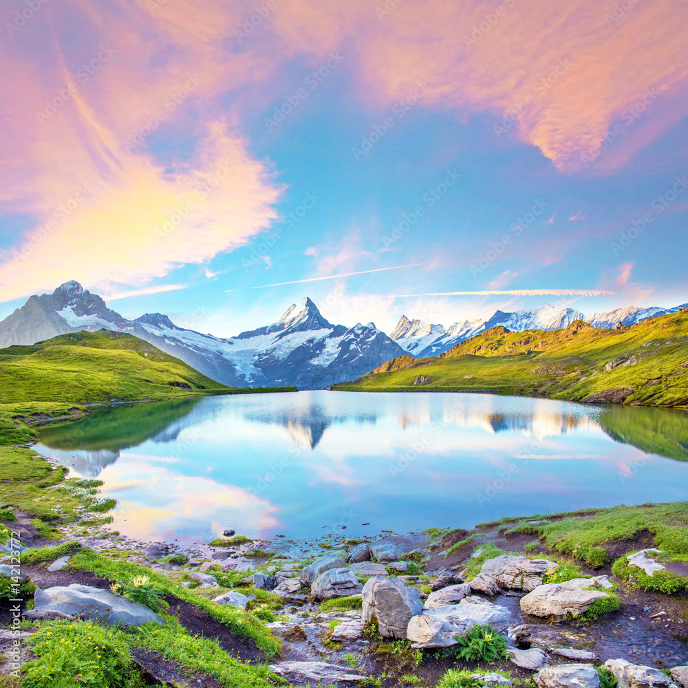 Fantastic landscape at sunrise over the lake in the Swiss Alps, Europe. Wetterhorn, Schreckhorn, Finsteraarhorn et Bachsee. ( relaxation, harmony, anti-stress - concept).