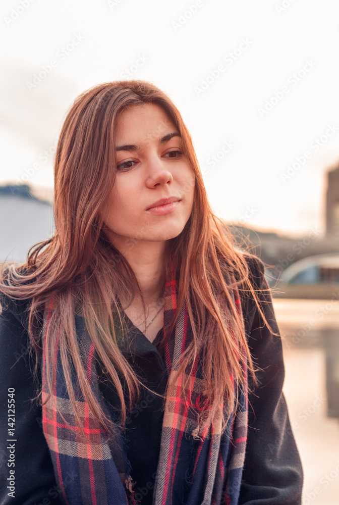 Young attractive girl in the city at sunset Young attractive girl in the city at sunset