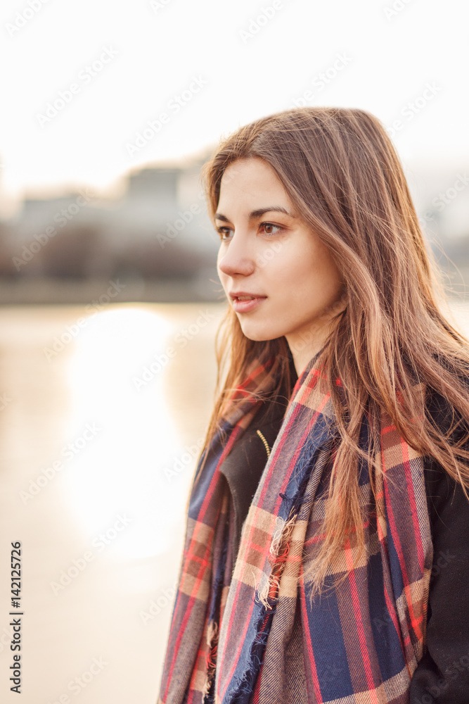 Young attractive girl in the city at sunset Young attractive girl in the city at sunset