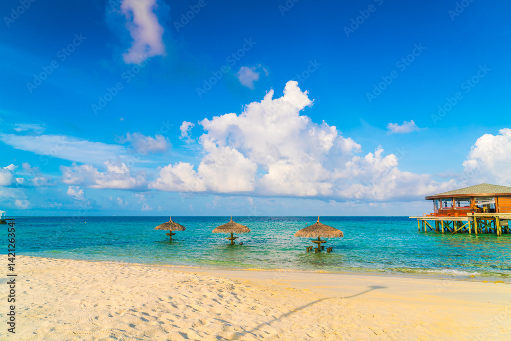 Fototapeta premium Beautiful tropical Maldives island with white sandy beach and sea .