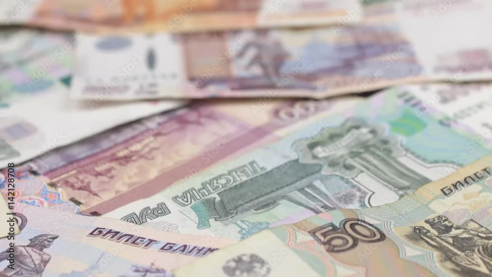 Approaching close up dolly shot of scattered Russian paper money. Approaching close up dolly shot of scattered Russian paper money.