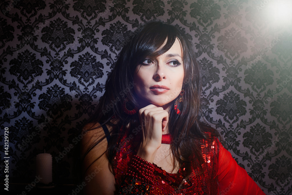 beautiful woman in red dress in the interior beautiful woman in red dress in the interior