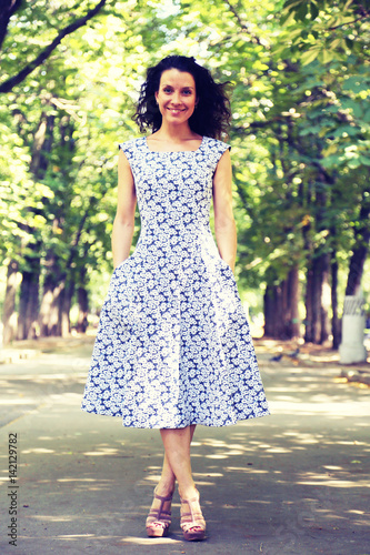 Stylish woman walking down the street