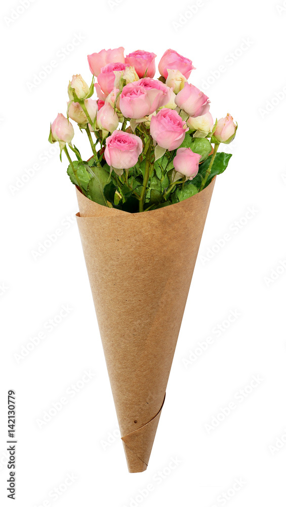 Fototapeta premium Small pink rose flowers in a paper cornet