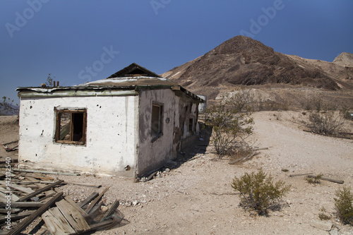 Abandoned buildings at the ghost town of Rhyolite in the Nevada desert 