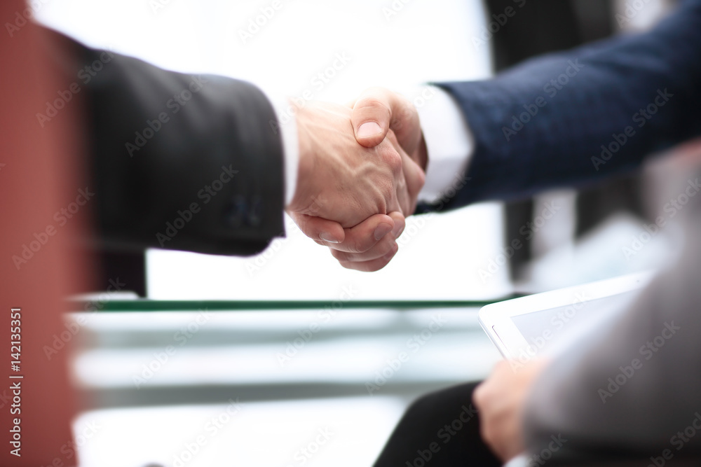 Close up view of business partnership handshake concept.Photo of two businessman handshaking process. Close up view of business partnership handshake concept.Photo of two businessman handshaking process.