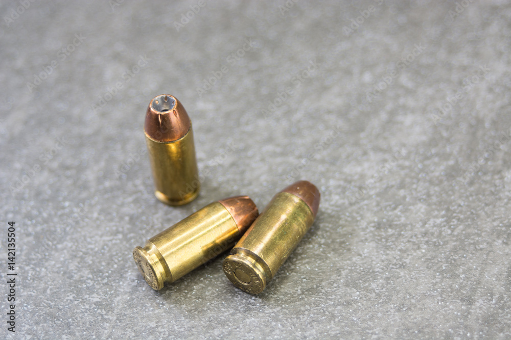 Three .40 Rounds on charcole tile Three .40 Rounds on charcole tile