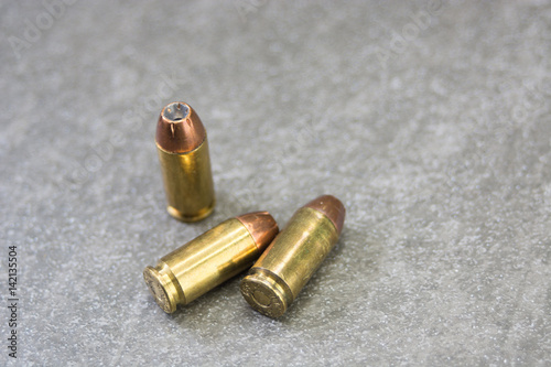 Three .40 Rounds on charcole tile