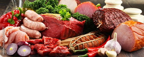 Variety of meat products including ham and sausages photo