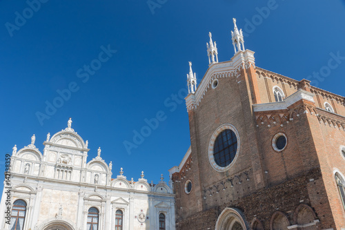 The Basilica di San Giovanni e Paolo (brick building) and The Scuole Grandi (marble building) in Venice (Italy) photo