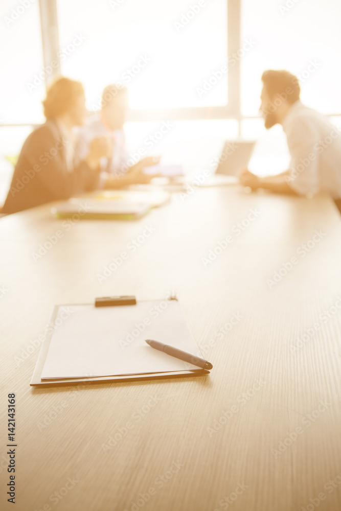 Obraz premium Toned focus on contract for new worker. Freelancer and businessmen represented on background. Interview in office. Contract for work concept.