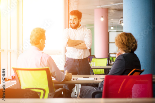 Toned of confident handsome man communicating with employees. Young bearded man knows how to get positive assessment to get job position.