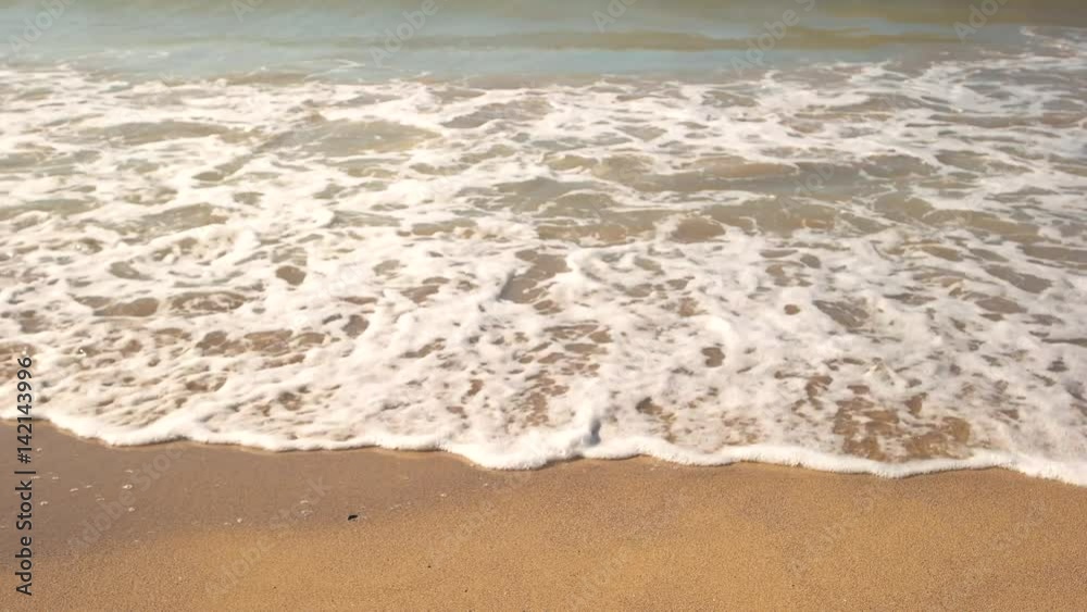 Small wave on the shore. Water with foam. Island amidst the sea. Best place to relax. Small wave on the shore. Water with foam. Island amidst the sea. Best place to relax.