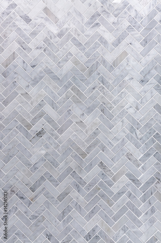Fototapeta Background of grey and white marble tile in herringbone pattern