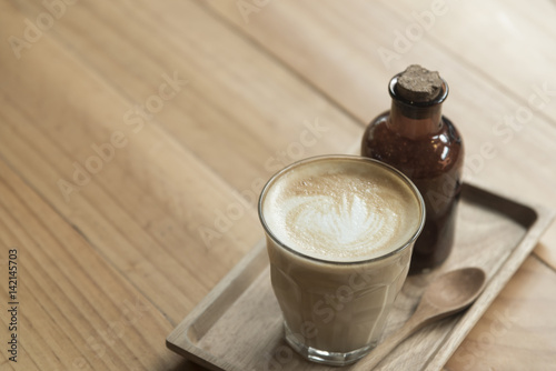 Coffee latte art with organic sugar photo