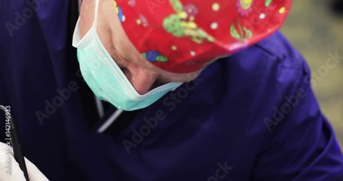 4K Close up. Doctor in mask making plastic surgery. photo