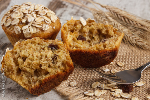 Fresh muffins with oatmeal baked with wholemeal flour and ears of rye grain, delicious healthy dessert