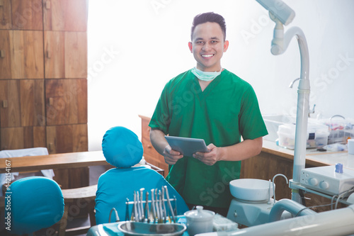 Photography dentist talking to his patient at dental care clinic