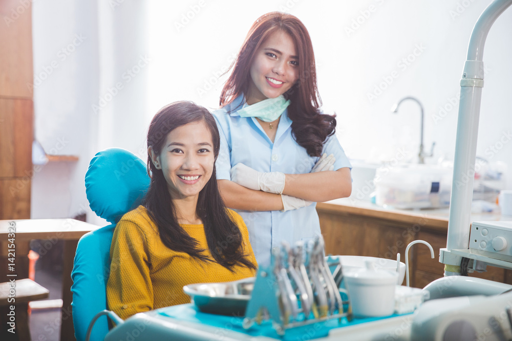 dentist talking to his patient at dental care clinic dentist talking to his patient at dental care clinic