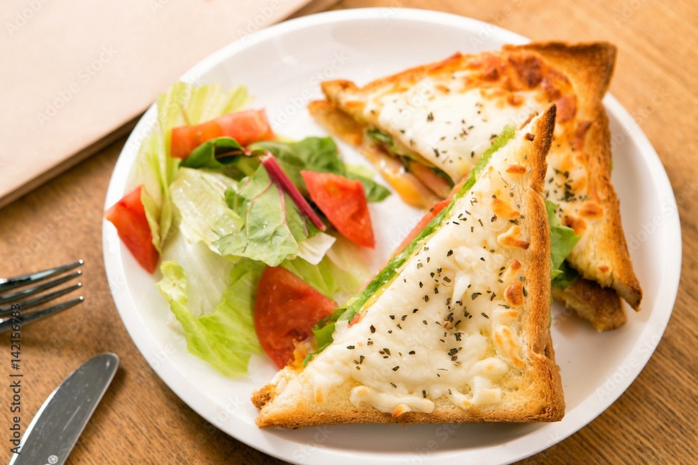 Cheese On Toast Being Grilled In Oven