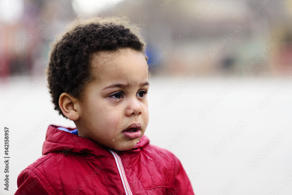 Portrait of a little upset toddler boy crying. Portrait of a little upset toddler boy crying.