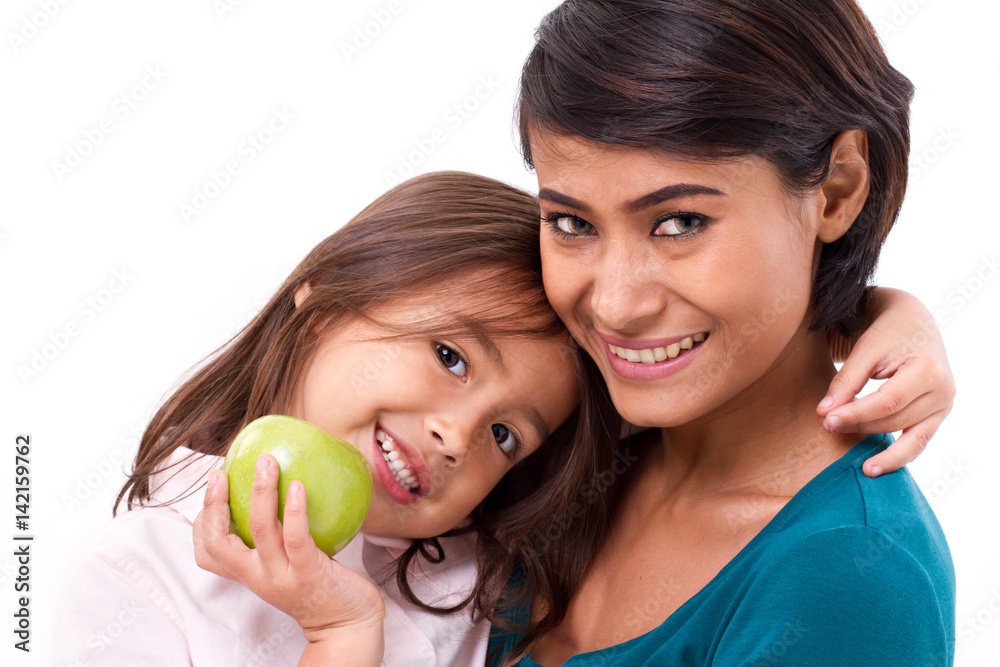 © 9nong - happy family, mother and daughter with raw organic green apple, concept of healthy food