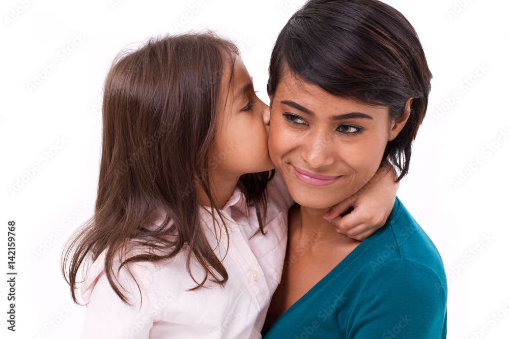 adorable little girl kissing her mother's cheek