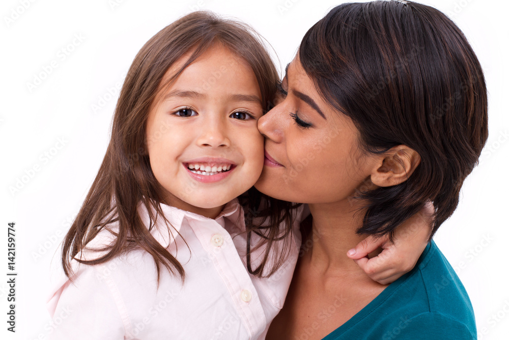 mother kissing her daughter's cheek, concept of family love mother kissing her daughter's cheek, concept of family love