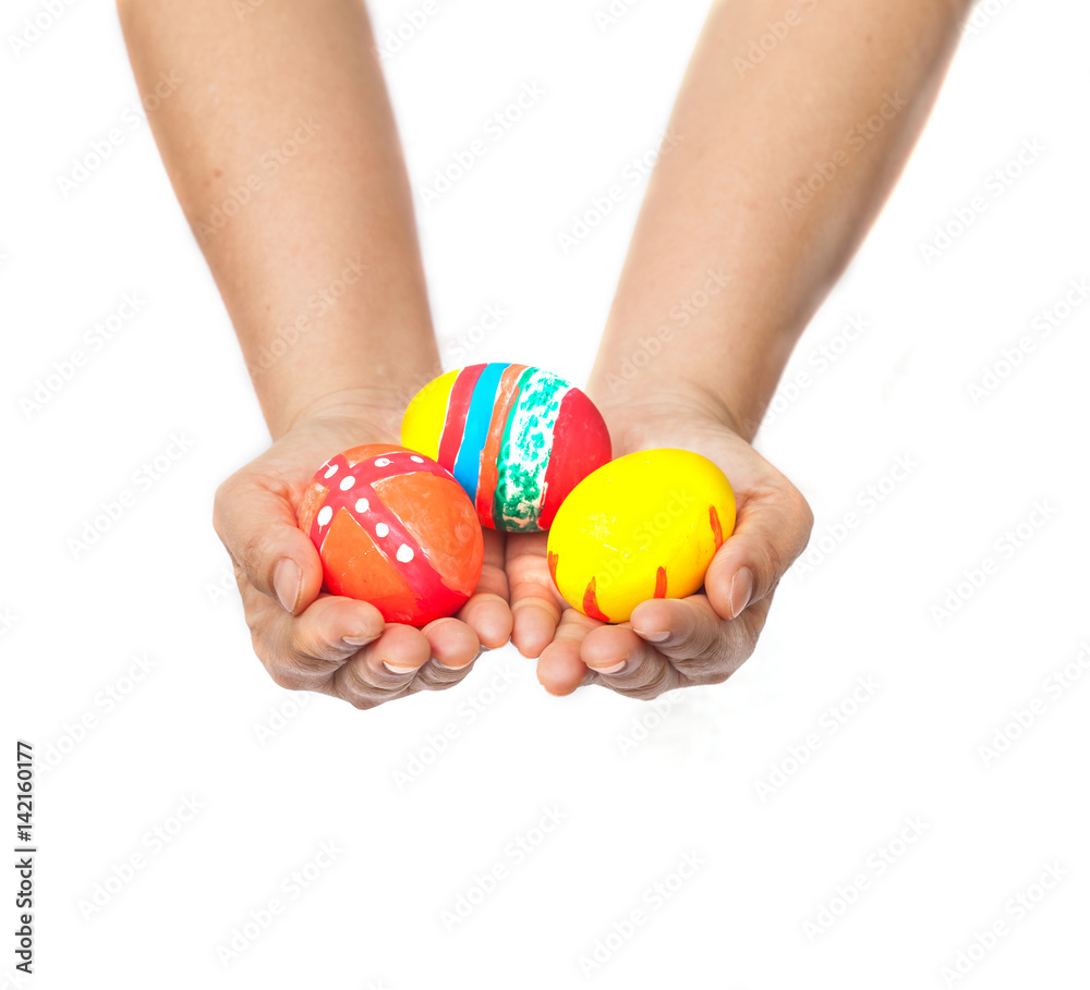 hand holding a easter egg on white hand holding a easter egg on white