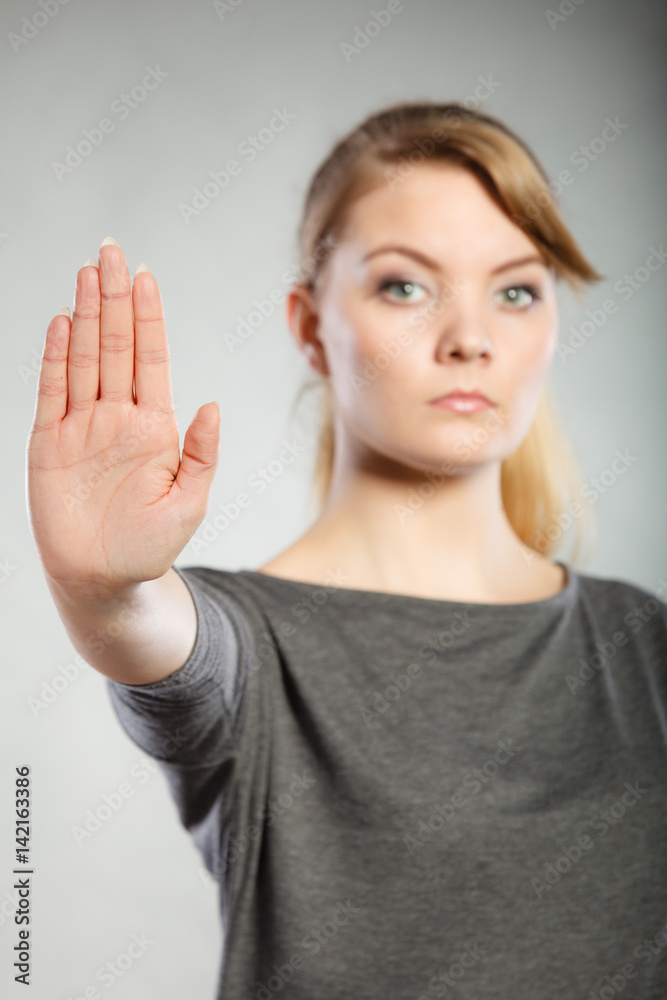 Assertive woman making stop gesture. Assertive woman making stop gesture.