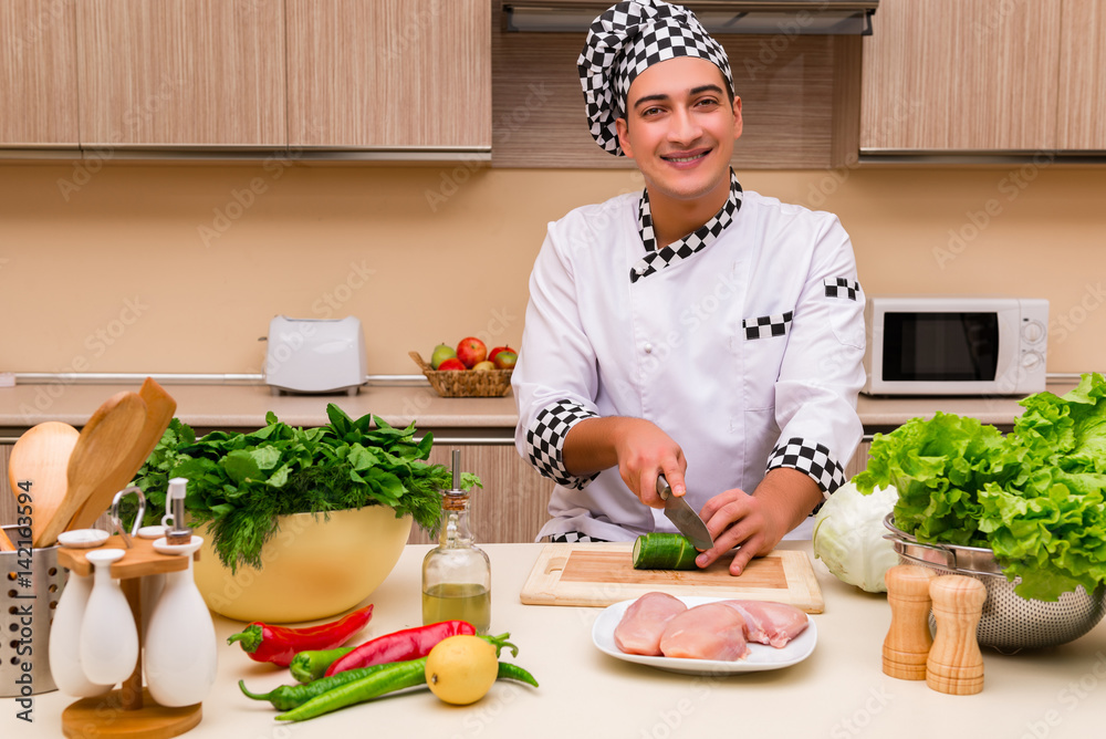 Young chef working in the kitchen