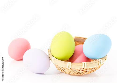 Easter eggs in basket on white