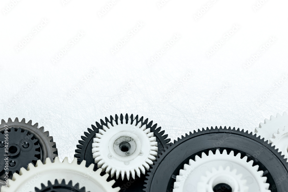 plastic gear cogwheels on industrial metal background plastic gear cogwheels on industrial metal background