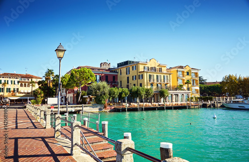 Bridge embankment yacht pier Lake Garda restaurants hotels luxury resort Sirmione Italy