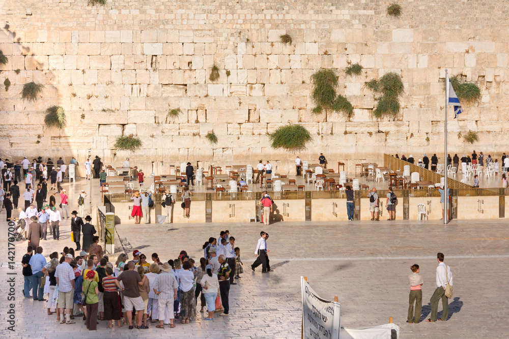 Naklejka premium Prayers and tourists on plaza before Wailing Wall in Old City of Jerusalem