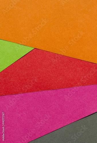 Bright red, green, orange, pink and black paper texture background