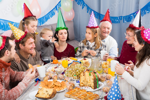 Family behaving jokingly during birthday party