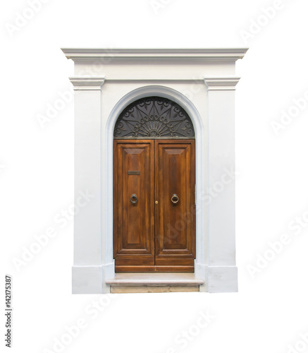 Wooden door in an old Italian house, isolated on white background, clipping path.