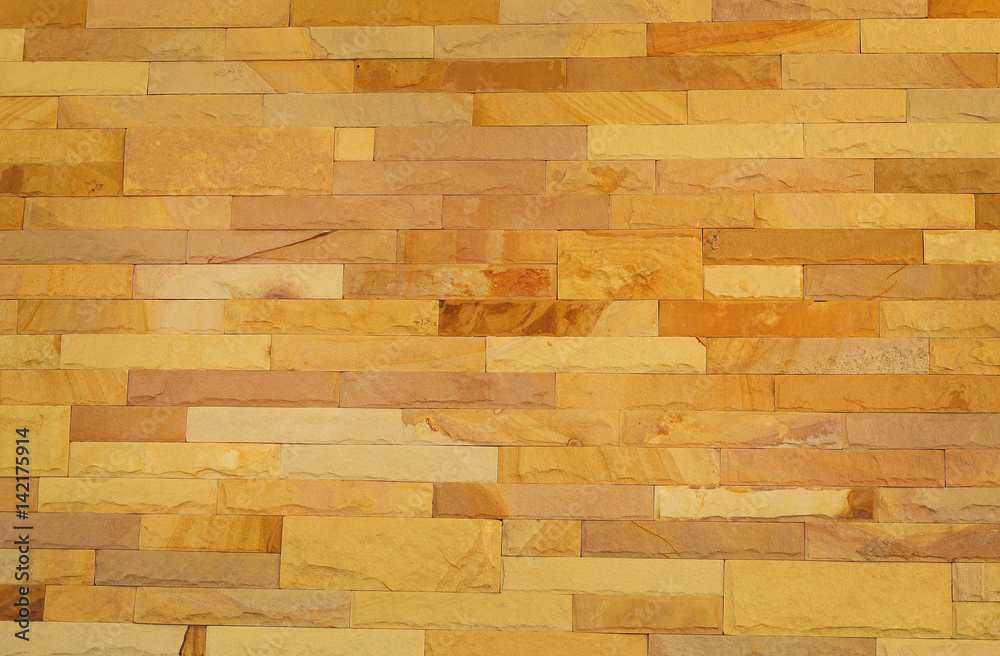 Obraz premium Pattern of rough sandstone wall texture for background and design.