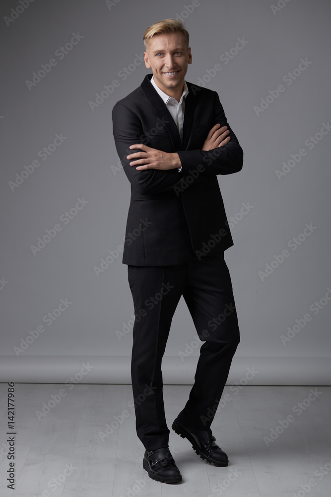 Handsome blond young man posing at studio Handsome blond young man posing at studio