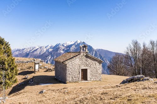 Chapel on Monte San Simeone in the background Monte Chiampon photo