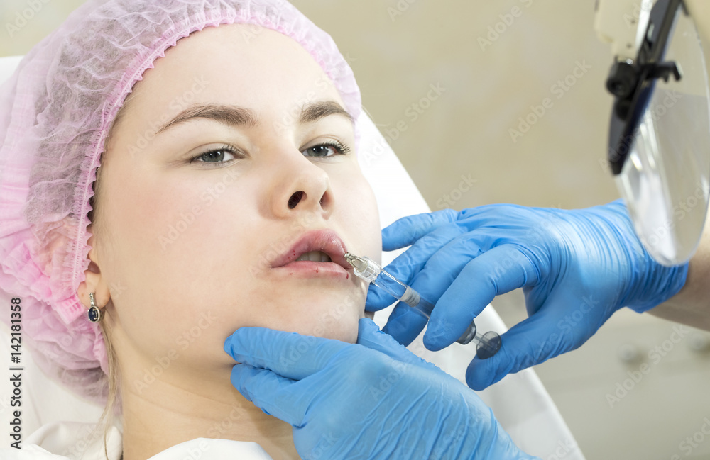 The process of cosmetic surgery of water injection in the area of the lips of a woman The process of cosmetic surgery of water injection in the area of the lips of a woman