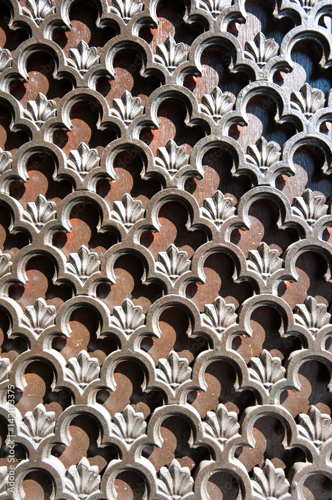 Antique floral pattern of protective iron grille Antique floral pattern of protective iron grille