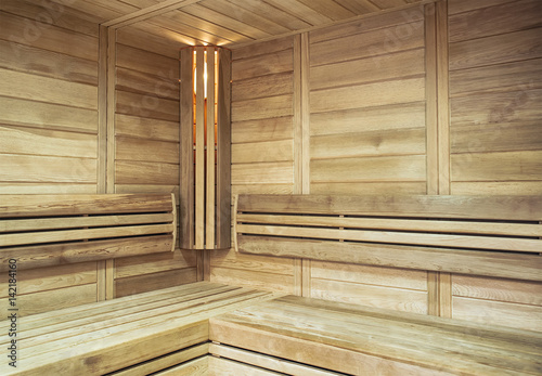 The cozy interior of the sauna with illuminated in the corner